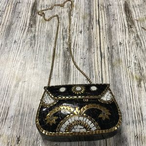Antik Kraft handcrafted metal clutch with chain belt. Made in India.